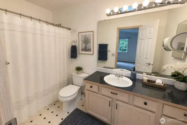Primary bathroom has been virtually staged