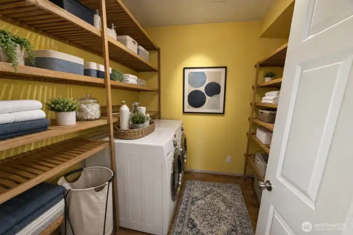 Downstairs laundry room has been virtually staged