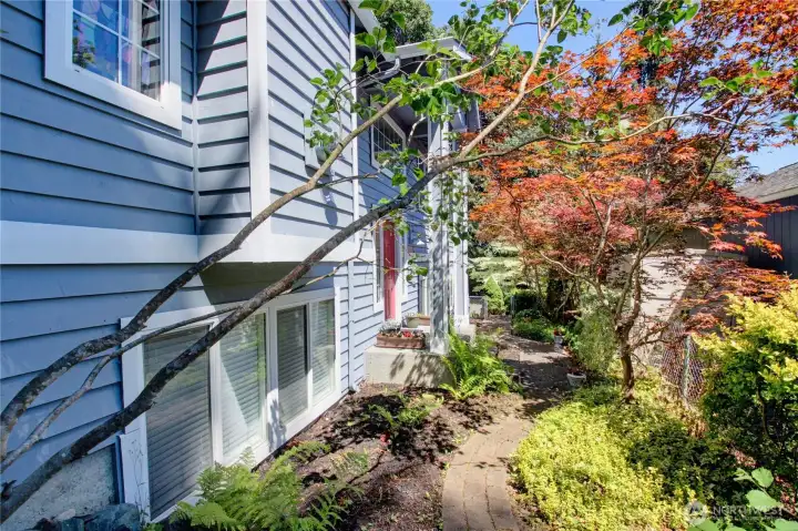 Has a walkway all the way around the home. So many beautiful colors year round from the mature landscaping.