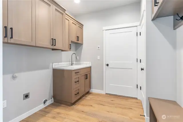 Utility room with bench.