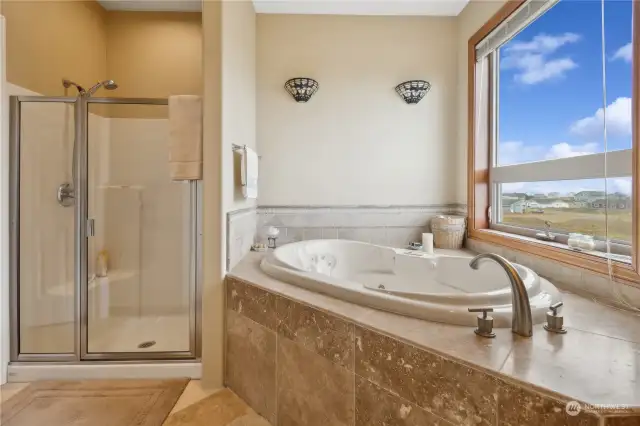 Soak in tub while enjoying ocean sunsets.