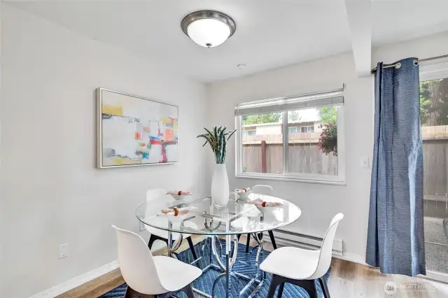 Well-appointed dining between the kitchen and living.