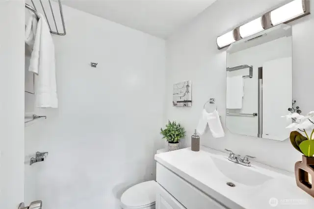 Three-quarters bath on main floor - a rare feature in the community where units only have a half bath.