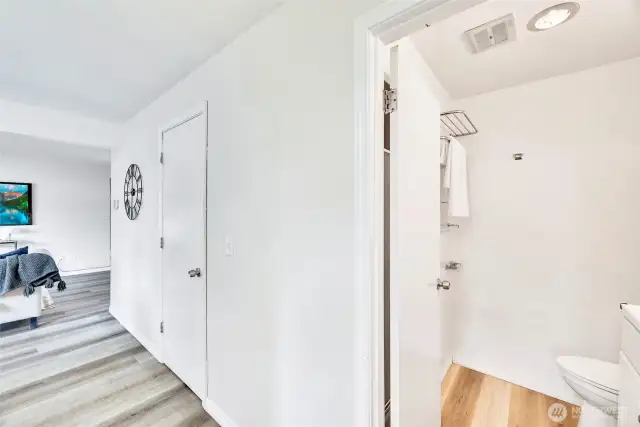 Right next to the main floor bath is a generous storage closet for convenient organization.