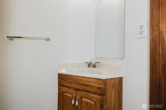 Powder room located upstairs on main floor