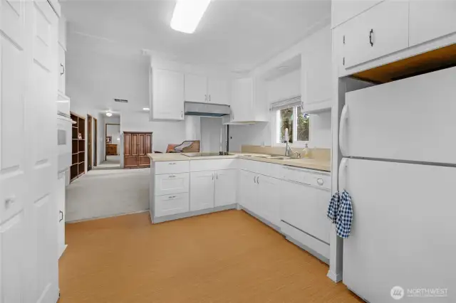 The kitchen opens to the bonus room.