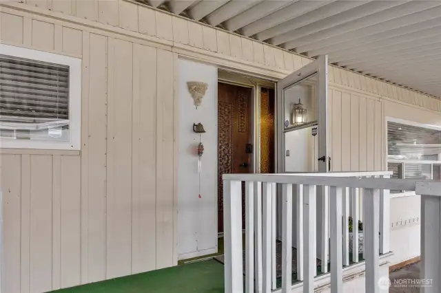 Front Entry door covered by the carport awning. Stay dry.
