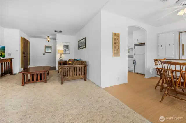 Manufactured wood flooring runs through the dining room and kitchen.