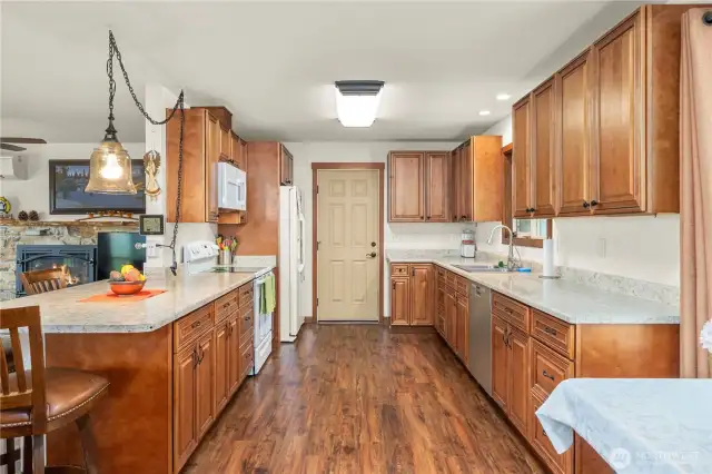 A closer view of the main floor (upstairs) kitchen. The door ahead goes out to the garage.