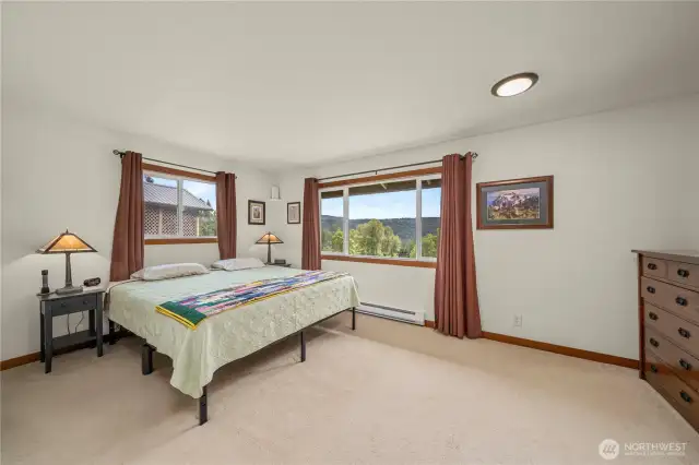 Primary bedroom upstairs with a walk-in closet and primary bath. And of course, the views!