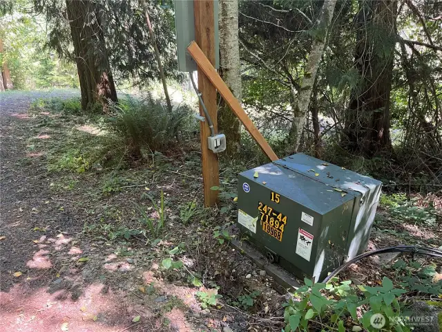 Power is to the property line.  See the incoming cables?