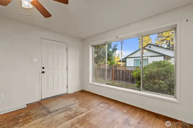 BIG WINDOW OFF SIDE OF LIVING ROOM