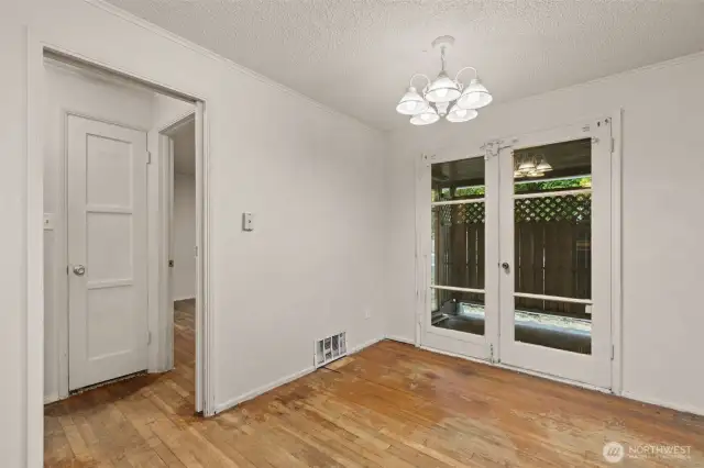 FRENCH DOORS TO ENCLOSED PATIO off dining area