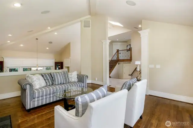 Living room a half-level above dining area with half wall.