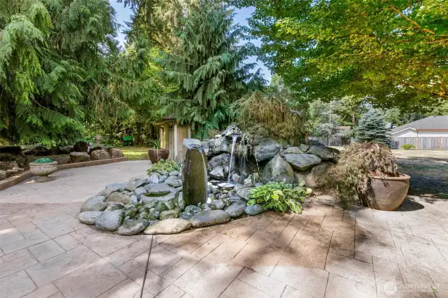 Fountain with shed behind