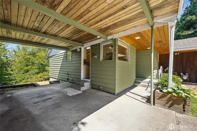 Carport. leads to the back yard and second enrty