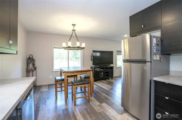 Seamless connection from kitchen to dining enhances the open layout.