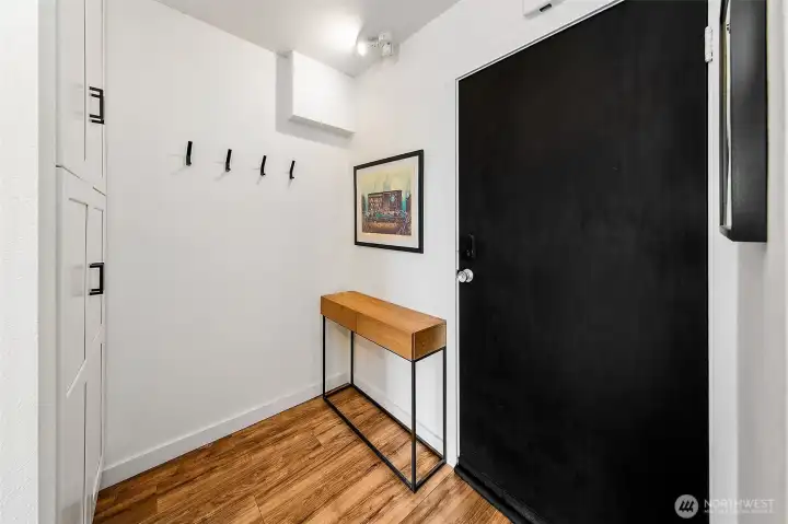 Spacious entry way with storage.