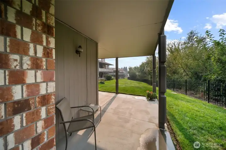 Covered patio with view of greenbelt.