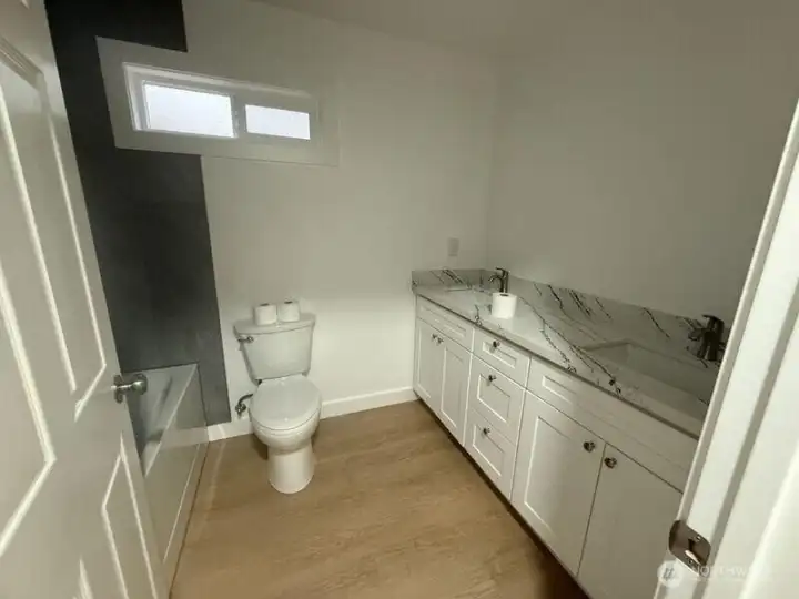 More pics are coming, but this is the super large bathroom, with 6 foot tub and vanity.