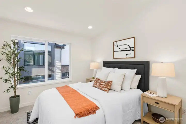 Tranquil bedroom retreat with serene views and space to unwind after a long day.