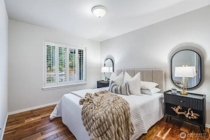 The flexible main-level den is ready to serve your needs—perfectly sized for a private home office, a cozy library, or easily convert to a main-floor guest bedroom as currently staged.