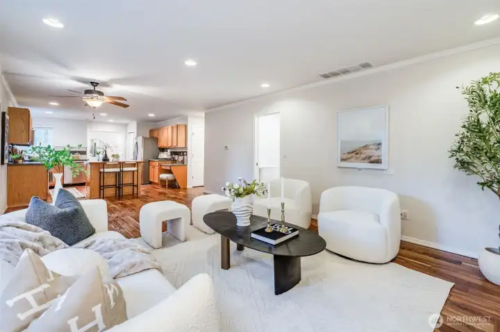 The heart of the home is the comfortable family room, which seamlessly adjoins the kitchen. Gather around the cozy gas fireplace, creating a warm and inviting atmosphere for everyday living and informal entertaining.