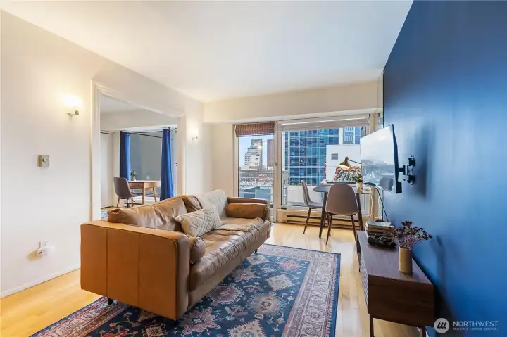 Open living room with floor-to-ceiling windows.