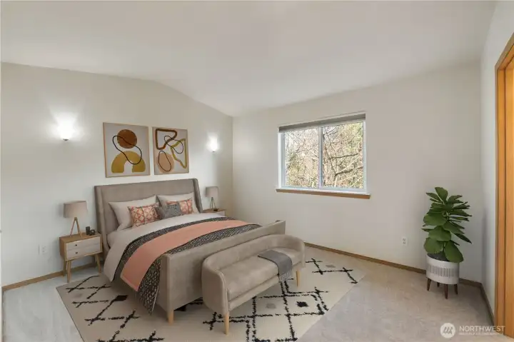 Virtually Staged. Light-filled primary suite with soaring vaulted ceilings, ambient sconces, peaceful territorial views, plus a walk-in closet and 5-piece ensuite including tub.