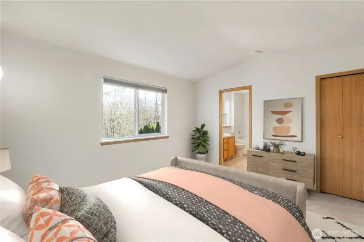 Virtually Staged. Light-filled primary suite with soaring vaulted ceilings, ambient sconces, peaceful territorial views, plus a walk-in closet and 5-piece ensuite including tub.