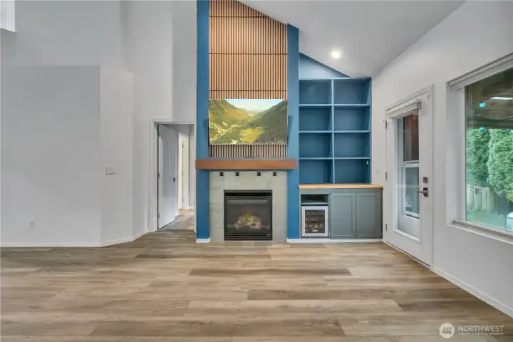 Fantastic feature wall with built ins and wine fridge too!