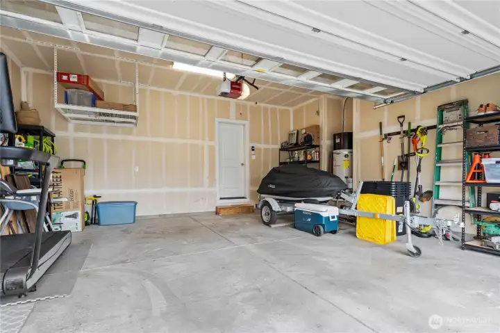 Attached garage with Liftmaster quiet close door with auto-close capabilities