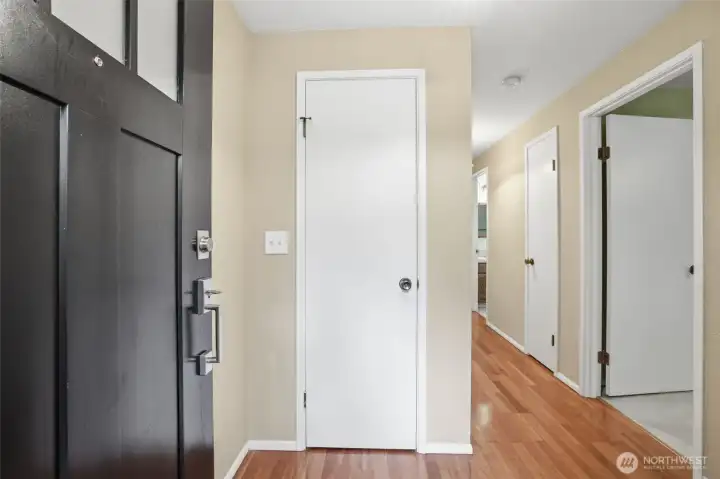Entry includes coat closet and warm hardwood floors