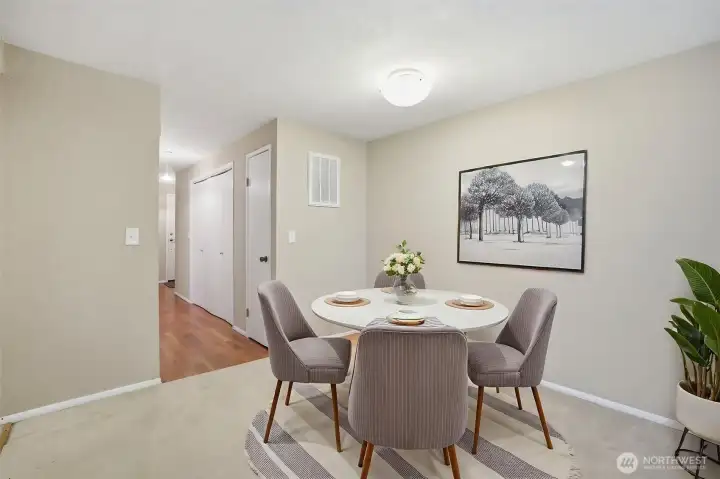 Dining area defined by good space and an overhead light
