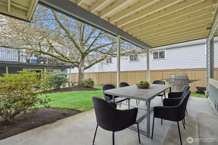 Private patio is so pretty with mature landscaping and gravel paths