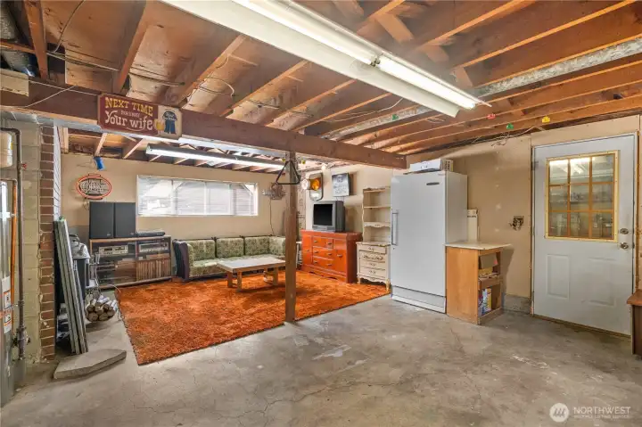 Basement with garage entry. Freezer stays