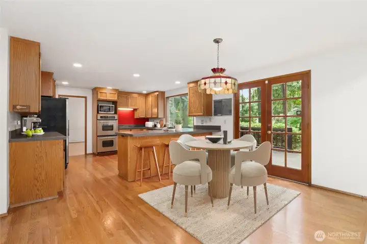 Kitchen with eating area. Hardwood floors. virtually staged