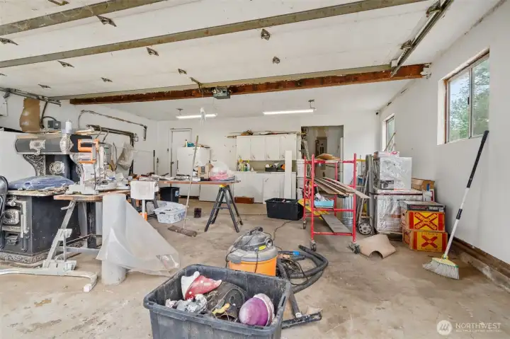 Oversized 2 car garage with additional space at back and crawlspace access