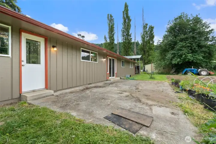 Spacious rear patio with access to utility and half bath