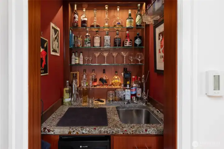 Stylish custom wet-bar in dining room.