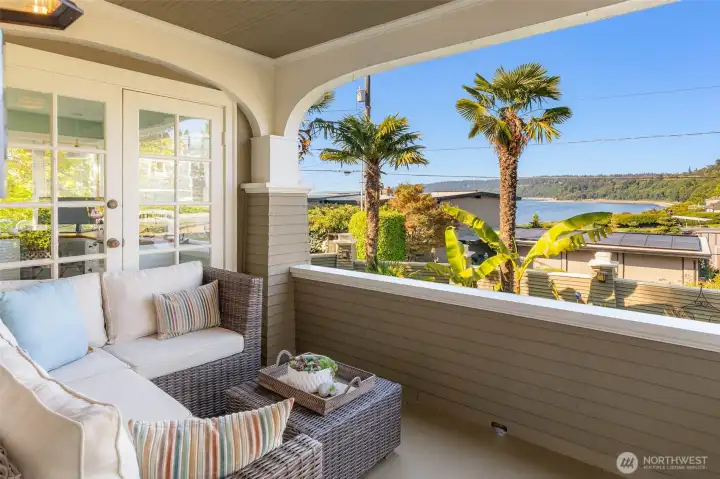 Charming covered front porch with views of the Sound.