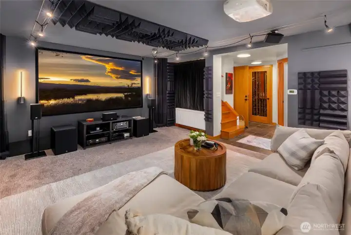 media room with acoustic sound panels, 120-inch screen and projector.