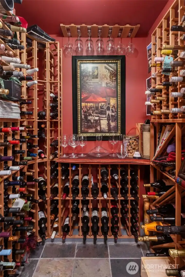 Beautifully appointed wine cellar in the lower level.