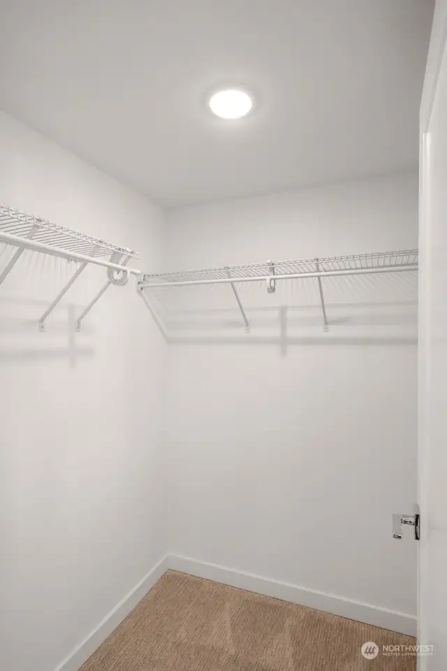 Spacious walk-closet makes organizing personal items an ease! (Photos of similar home in Willow North)