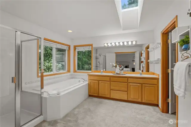 Ensuite features dual sinks, large soaking tub and walk-in shower.