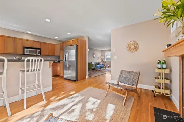 Kitchen + bar seating open to 2nd living space