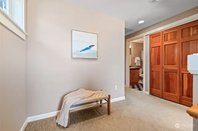 Landing between the two bedrooms on the top floor. Desk, storage, bookcases?