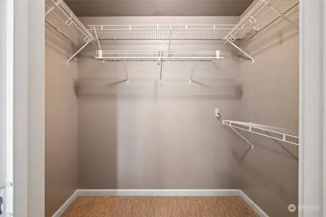 Walk-in closet in primary bedroom.