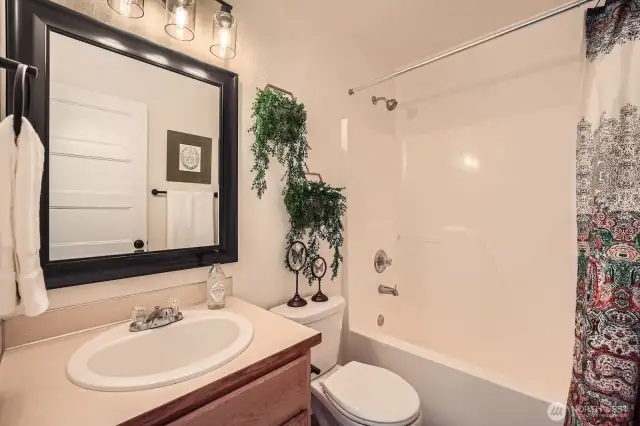 Modern full-size bathroom is shared with the 2nd and 3rd bedrooms.