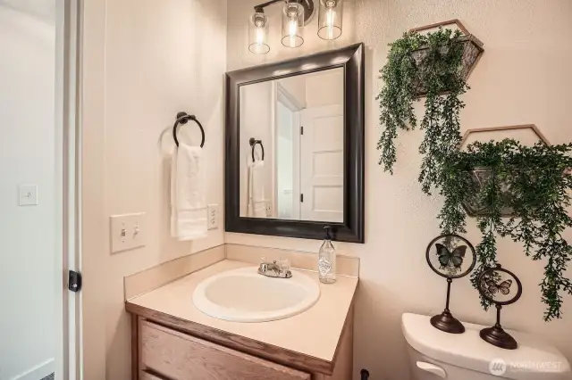 From the bathroom door to the lighting and mirrors, all details showcase clean and modern decor.